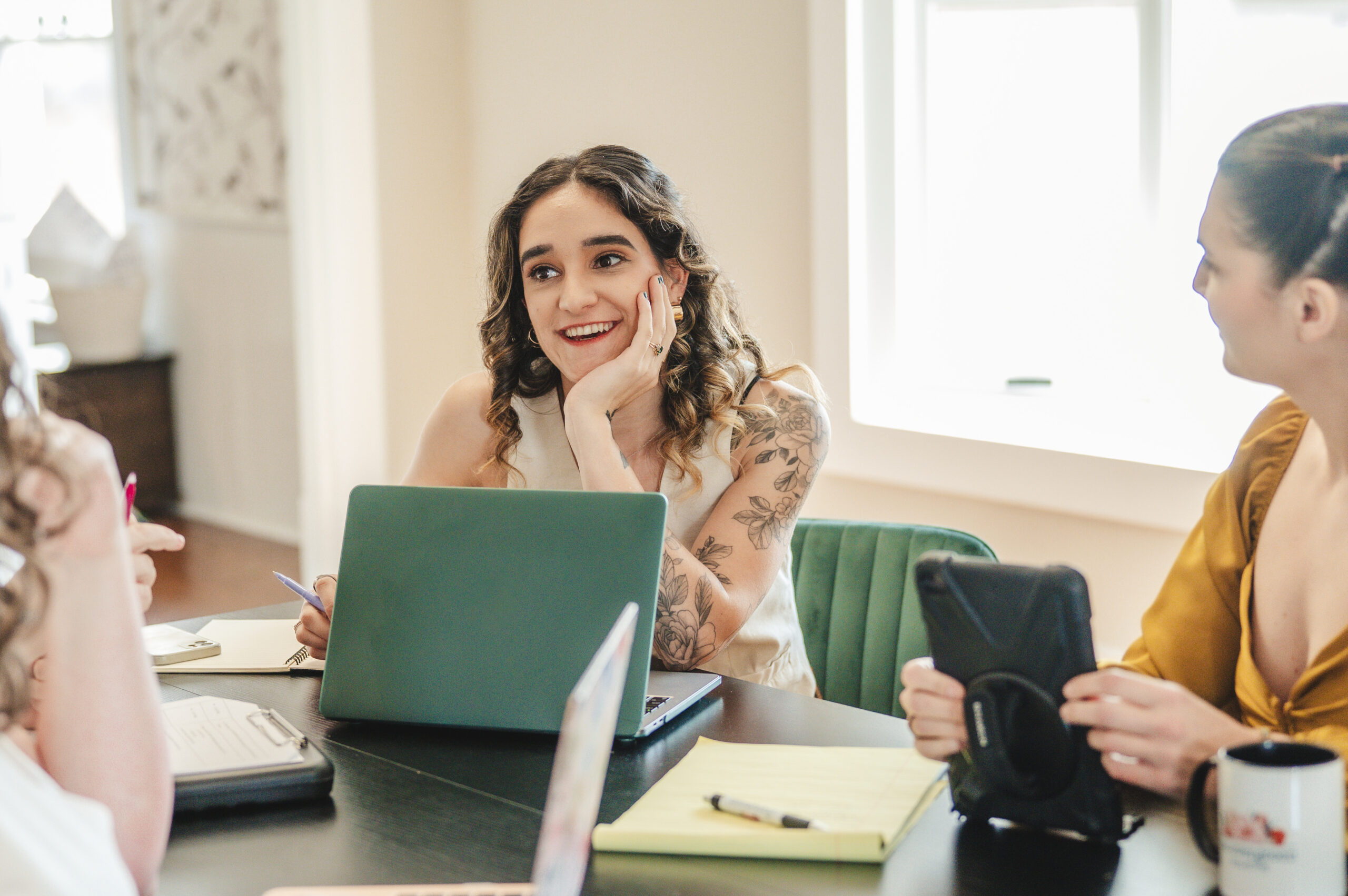 businesswoman working on laptop smiling